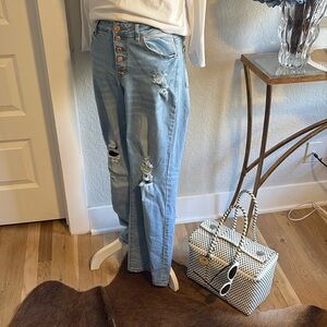 Button front distressed denim jeans. Size small.